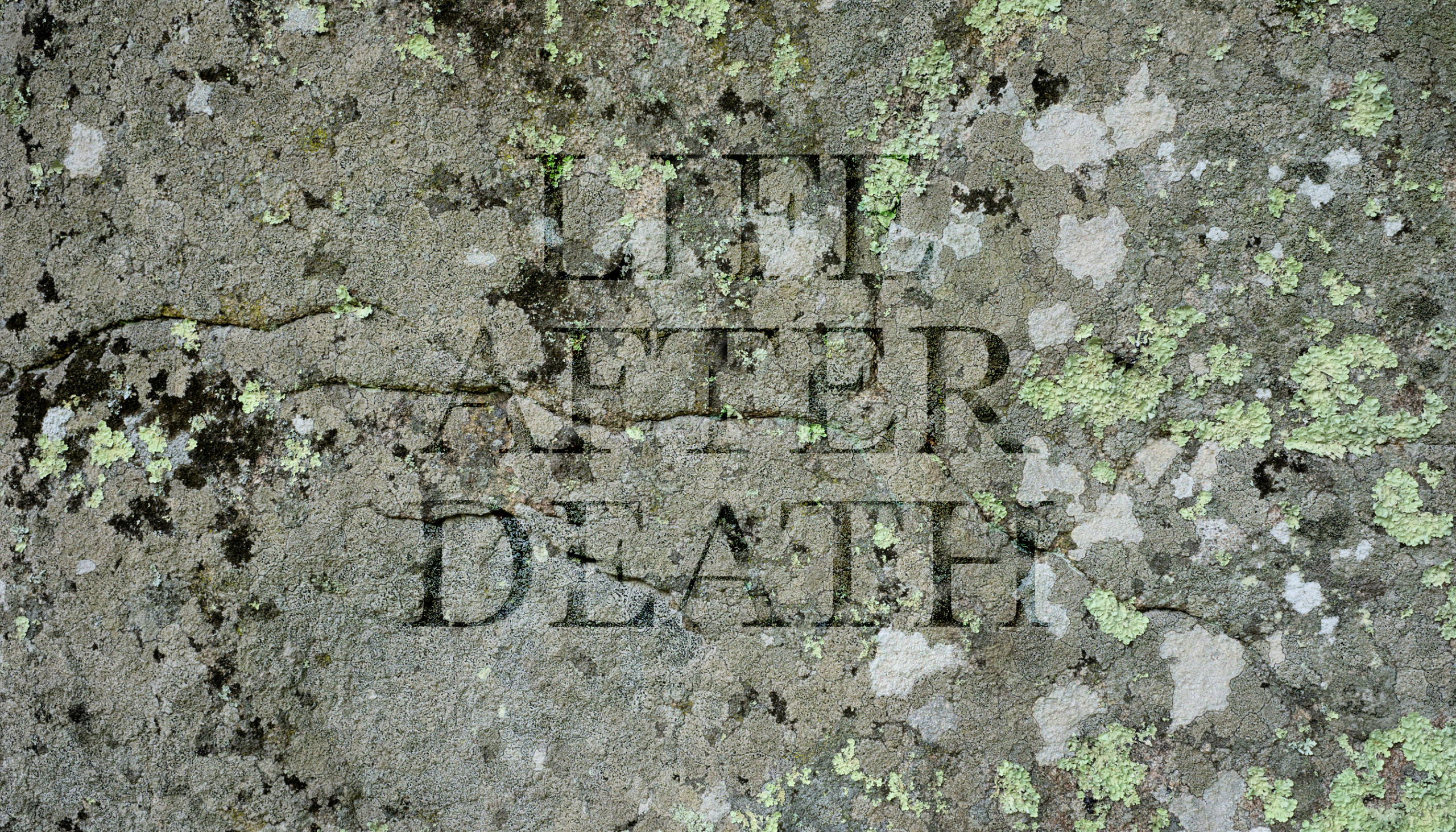 A stone surface with the words Life After Death carved into it.